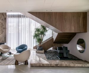Chic interior showcasing a modern staircase, elegant seating, and decorative elements. — Decorating Kitchens for Christmas